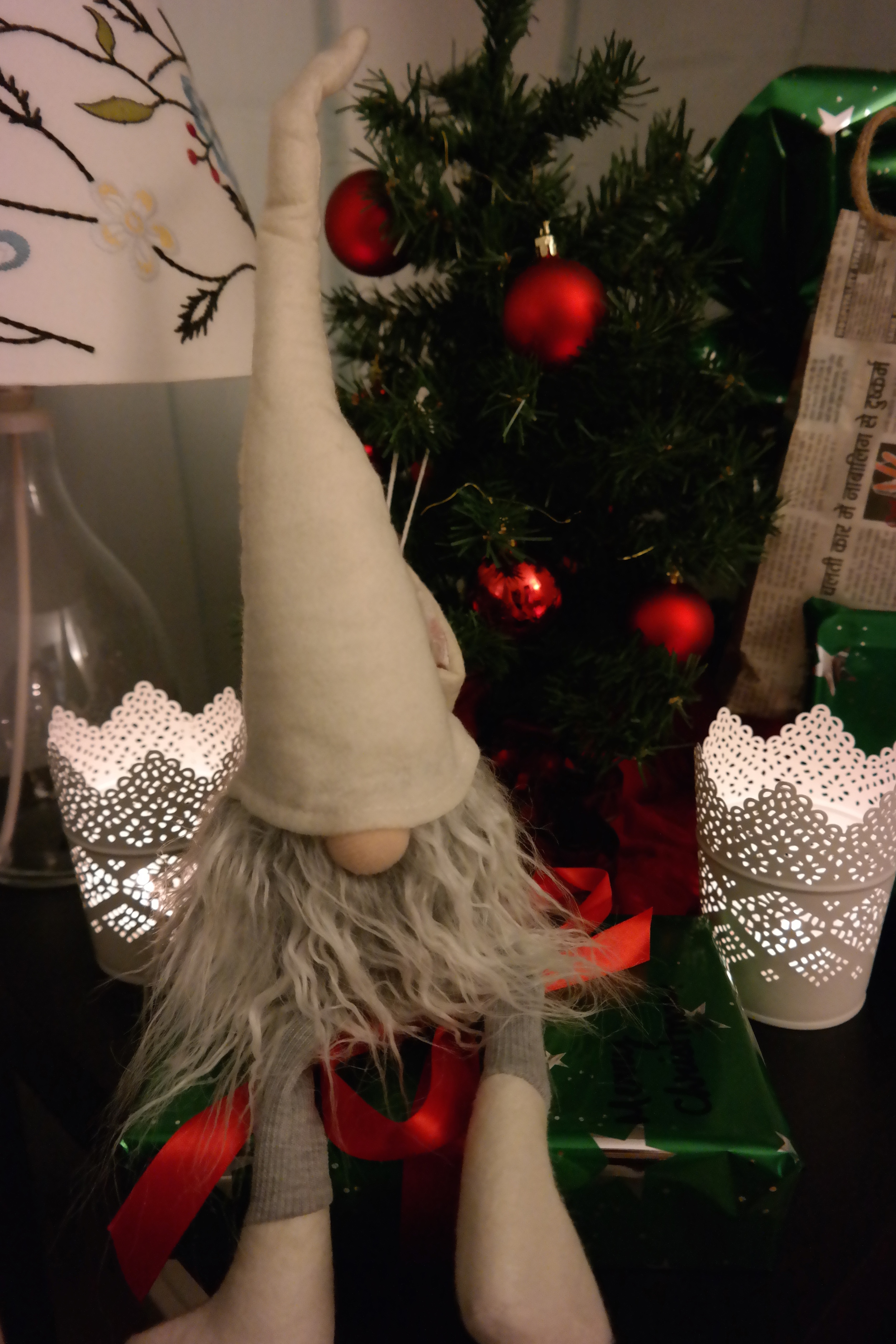 Our shelf-elf Otto presides over the gifting station. And yes, he's about the same size as our tree.