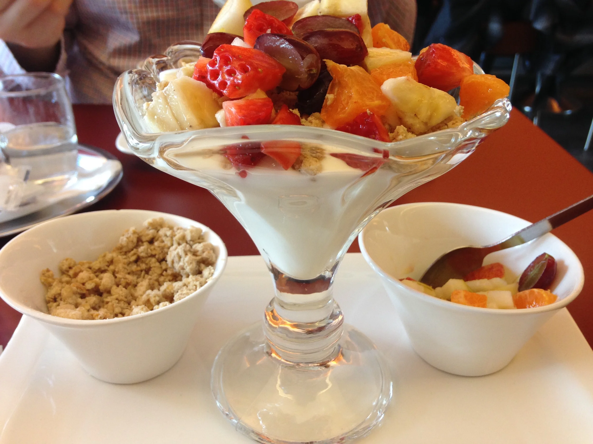 Austrian Breakfast of Champtions: creamy yogurt, chopped fruit, and the best granola I've ever had. My mouth is watering.