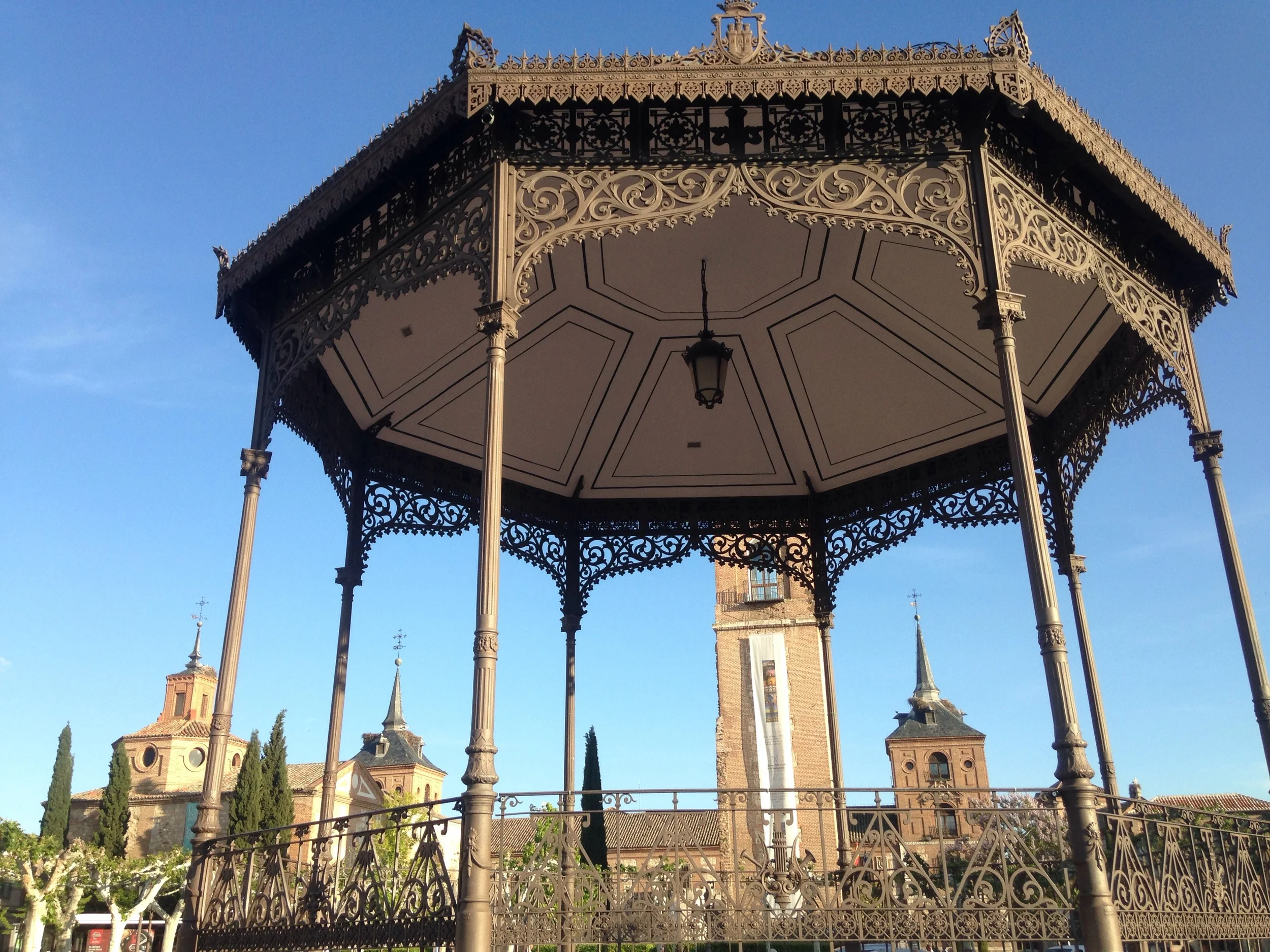 The gazebo and buildings near Cervantes against the blue sky.