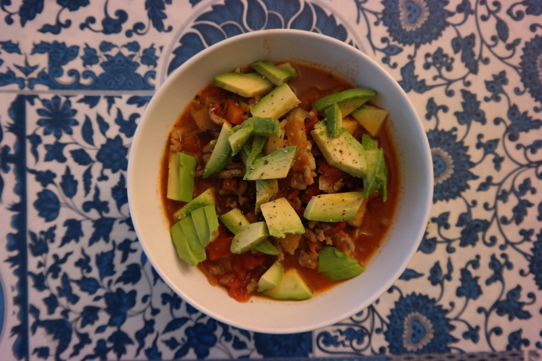 Beef and veggie chili, topped with avocado . I made up this recipe as I went, too, and it was both very satisfying AND a great way to get about 4 meals (or more!) out of one pot! I used ground beef, canned tomatoes, eggplant, zucchini, and bell peppers, plus chili seasoning, salt, and pepper.