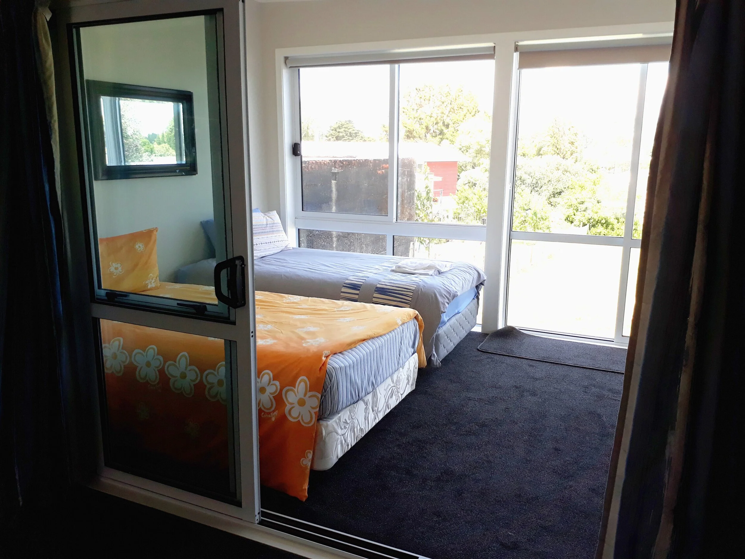 Room 6 TK Back unit back bedroom with 2 King Singles and garden.jpg