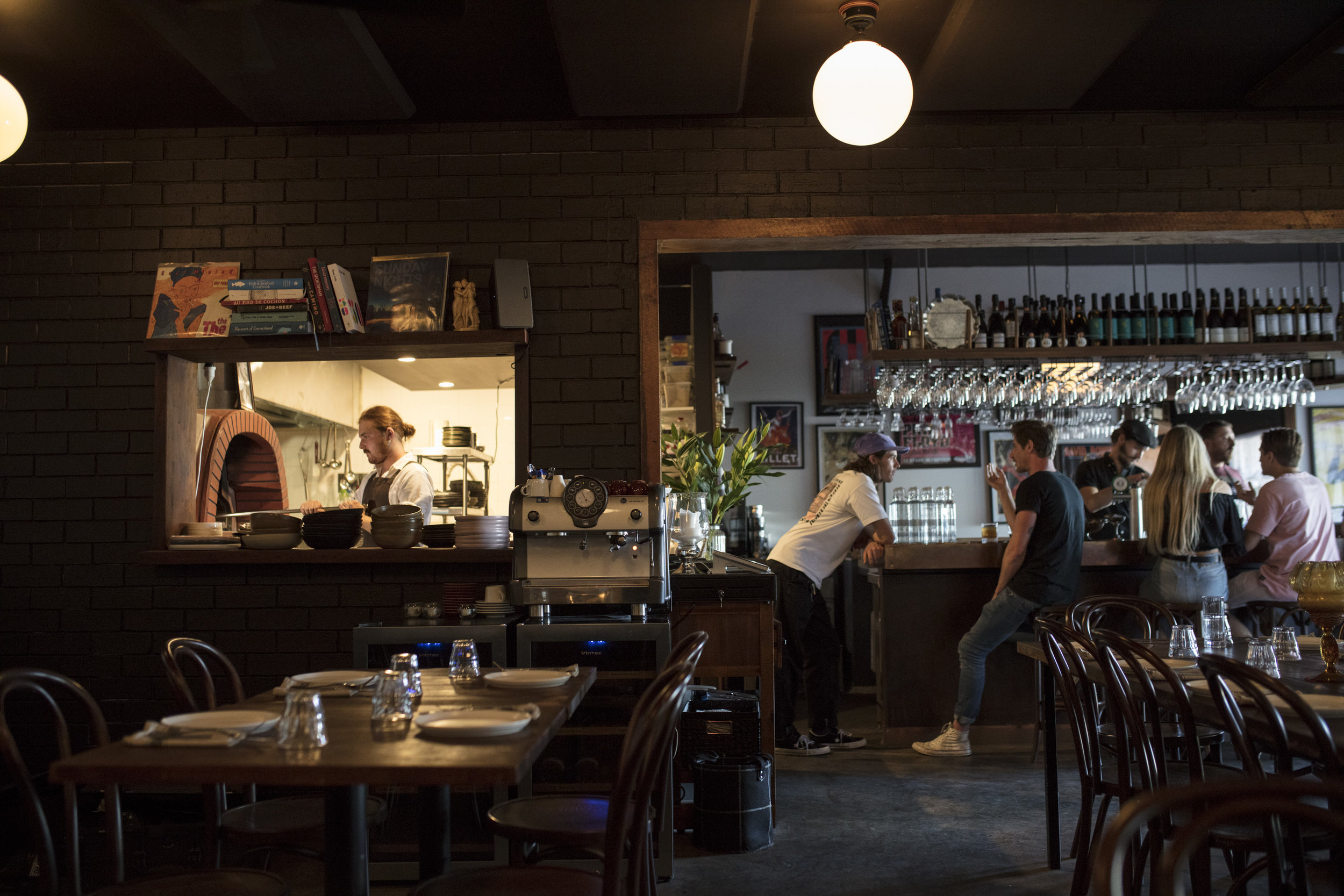  Lupo at 2460 Gold Coast Hwy,Mermaid Beach. Bar owner Harry Pearce working the wood fired oven. 
