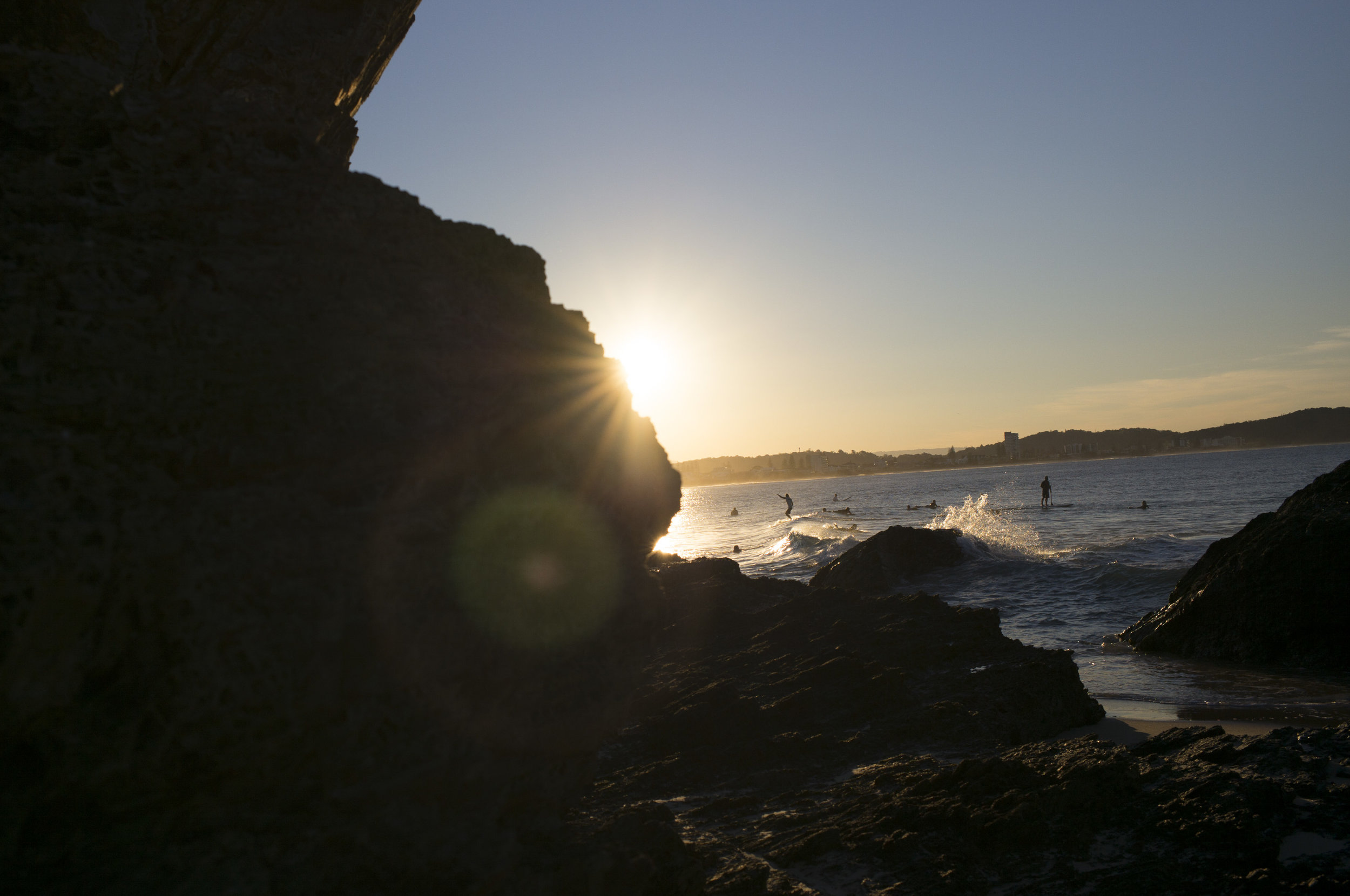  Surfers enjoying the last light at Currumbin Alley, Gold Coast, Qld, Australia 