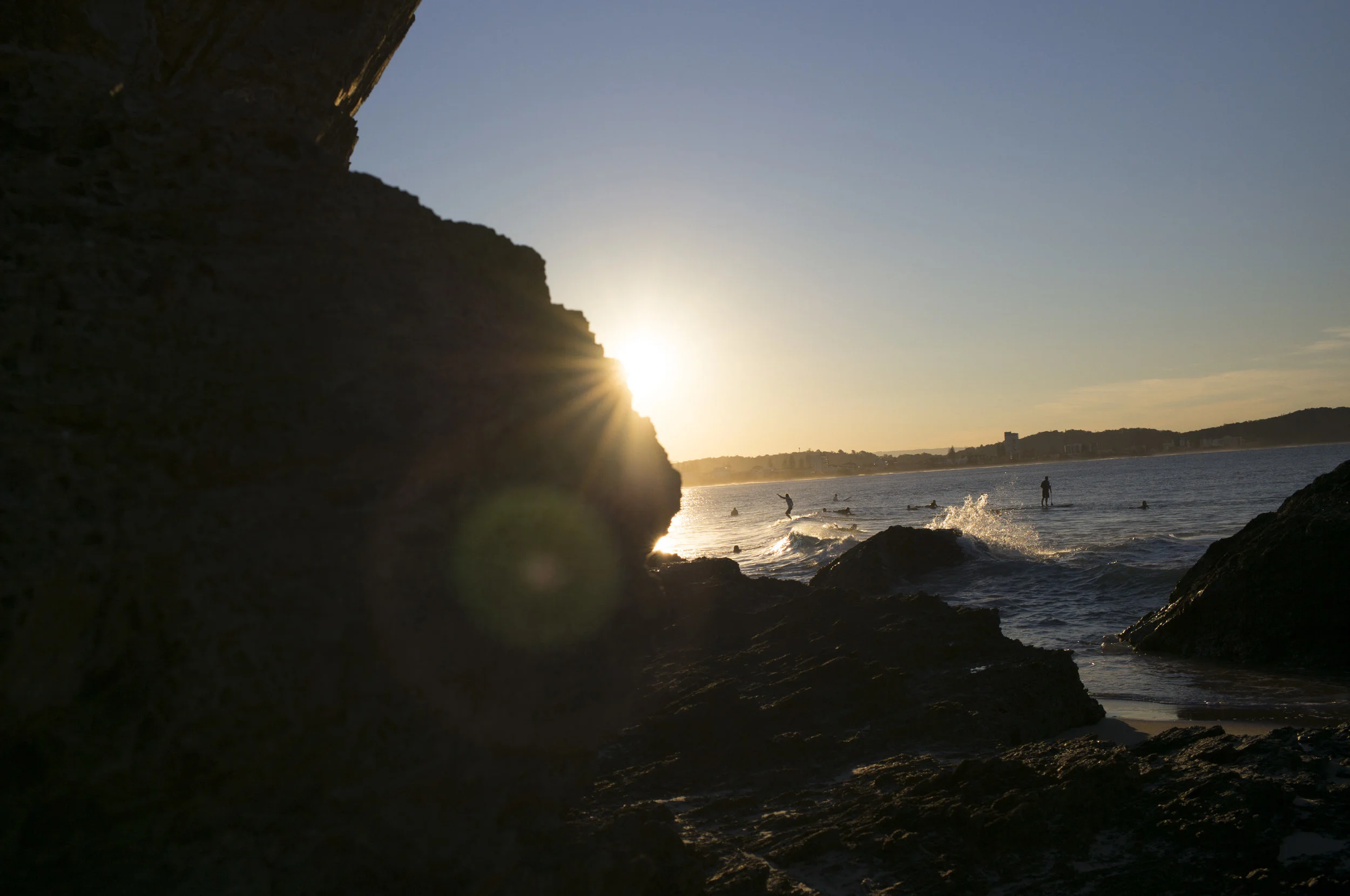 Surfers enjoying the last light at Currumbin Alley, Gold Coast, Qld, Australia