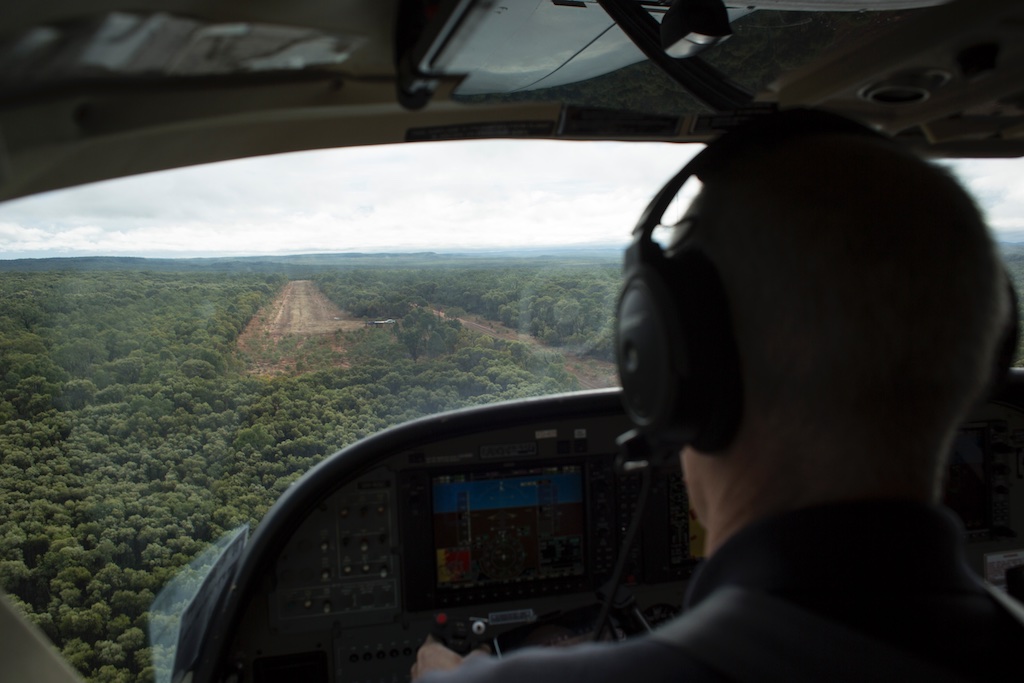  Royal Flying Doctor Service Clinic at Gilberton Station, Qld... RFDS Pilot Ross Thomas flying the aircraft and viewing the dirt landing strip 