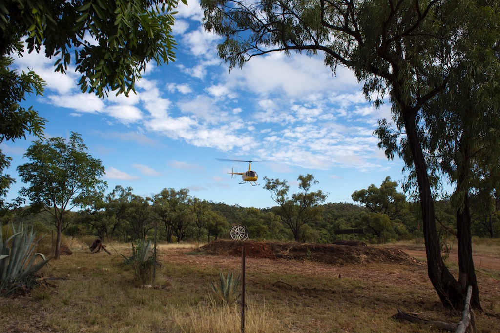  Royal Flying Doctor Service Clinic at Gilberton Station, Qld..a helicopter arrives to talk with the men from the stations about their cattle 
