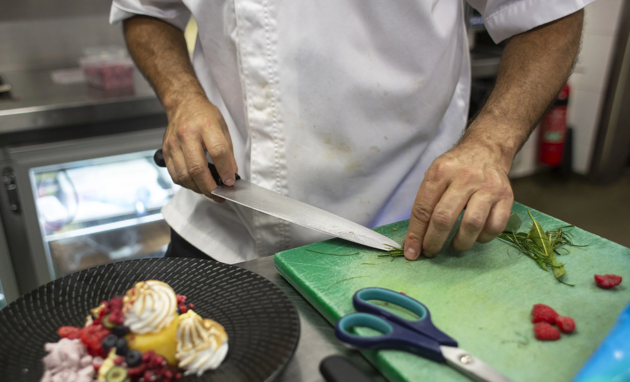 Executive Chef John Offenhauser prepares a Lemon Myrtle Meringue for Patina Restaurant, Customs House, Brisbane Australia. The Lemon Myrtle is used in the Ice Cream as well as being thinly sliced and used as a garnish. photography : Russell Shakespeare