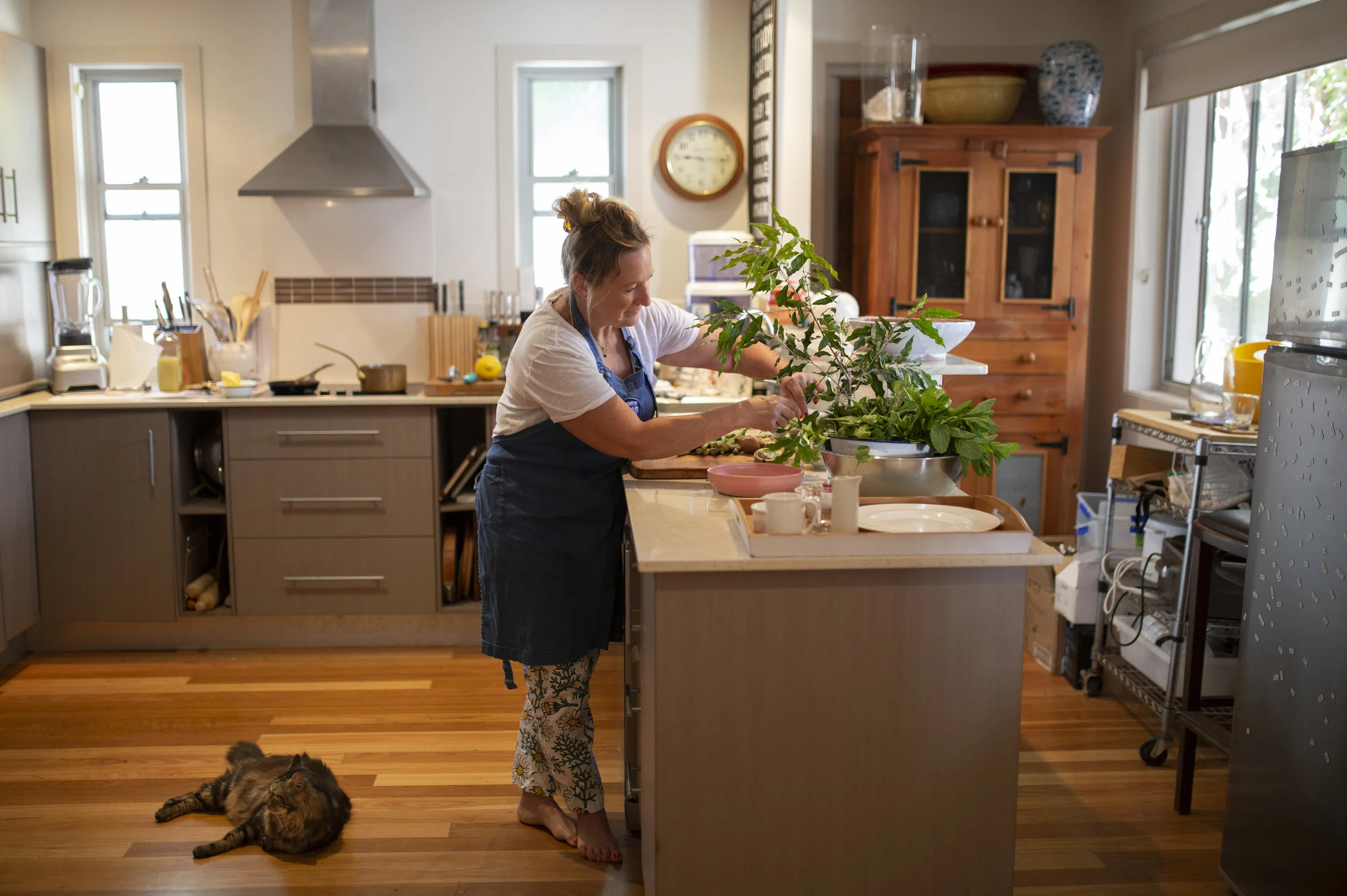 Executive Chef Samantha Gowing cooking up "Crispy Skinned Barramundi with Lemon Myrtle Butter Sauce" at her home in Byron Bay, NSW, Australia. Photography : Russell Shakespeare