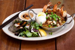 Chicken and shrimp biryani baked with peas, toasted almonds, egg and cilantro.