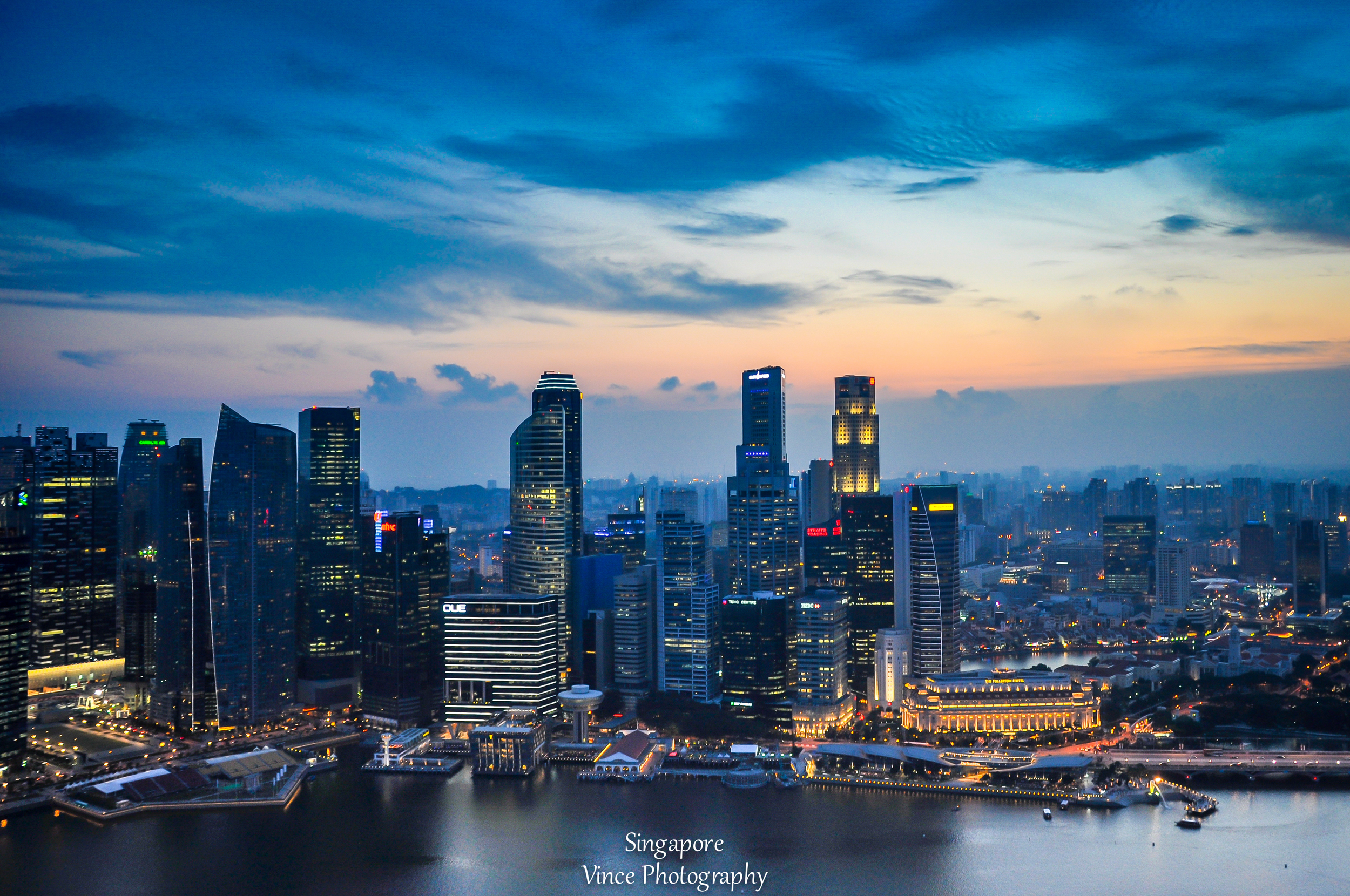 Singapore skyline view from rooftop of the Marina Bay Sands Hotel.