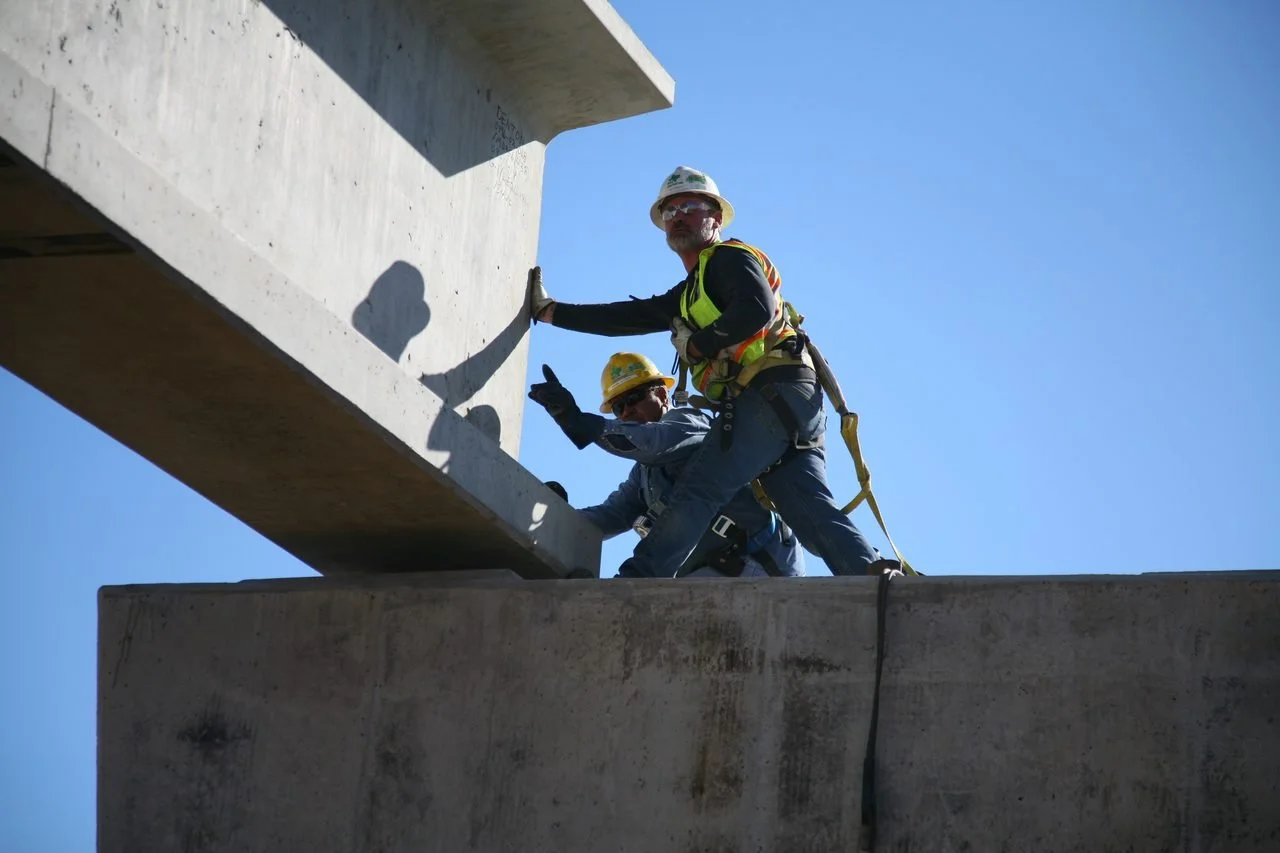 Pre-stressed concrete beam being set on the new I-35E bridge over Lewisville Lake, Highland Village, Texas, November 2014