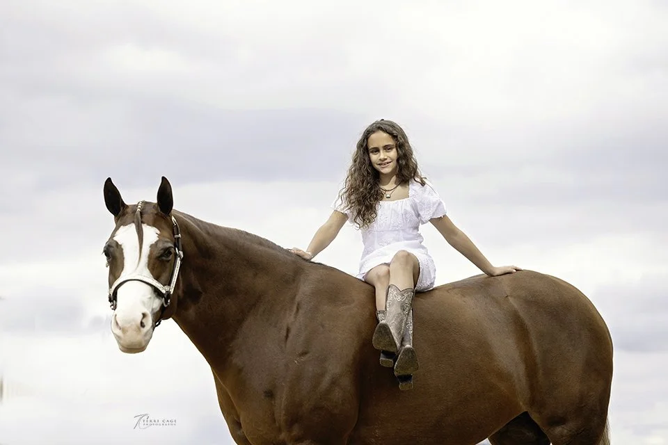 Sitting on a horse bareback sidesaddle for photos