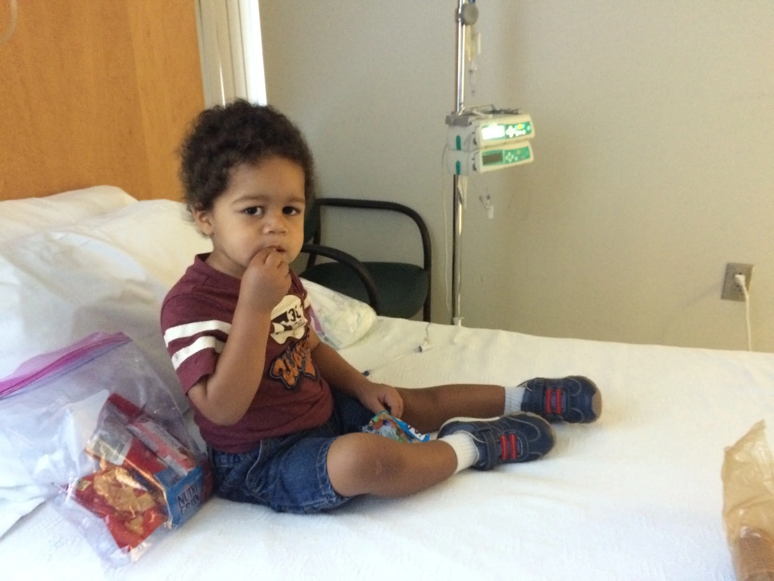 Day 446: Elliott has a snack while receiving immunoglobulin to boost his immune system at the oncology clinic.