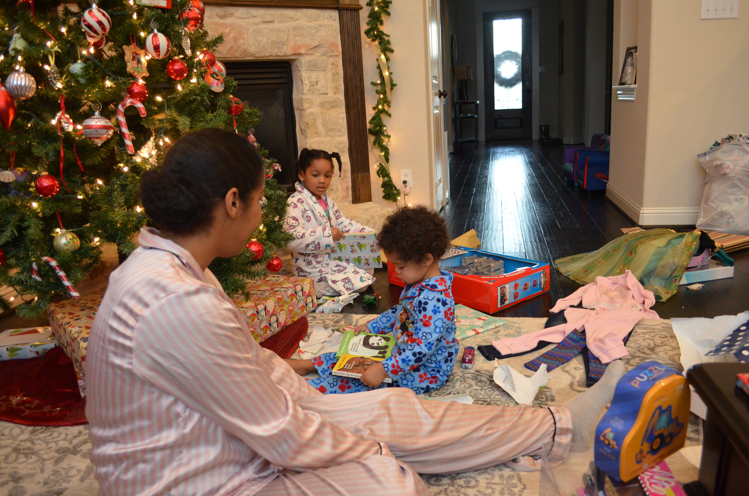 Day 520: Kyllan watches as Elliott and Laurel open gifts on Christmas day.