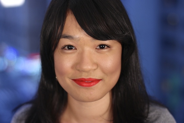 MAC Lady Danger lipstick is what Heather is wearing- it is a very bright orange/red matte lipstick.