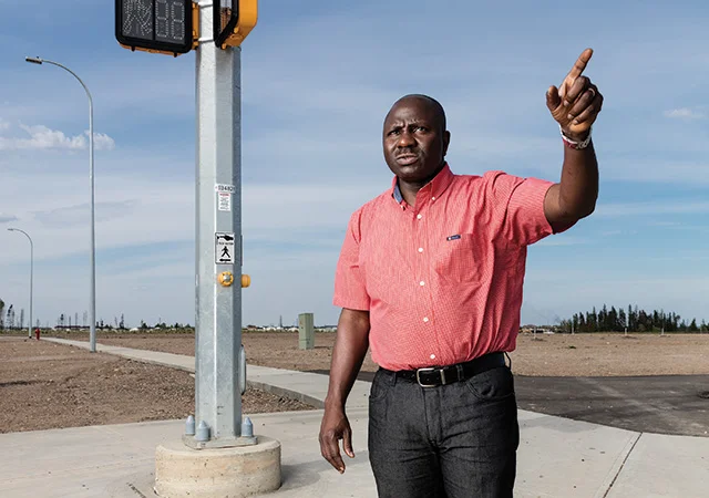 Kunle Oladebo, the pastor of Daystar Chapel, at Abraham’s land, the future site of his new church. Photograph Curtis Trent