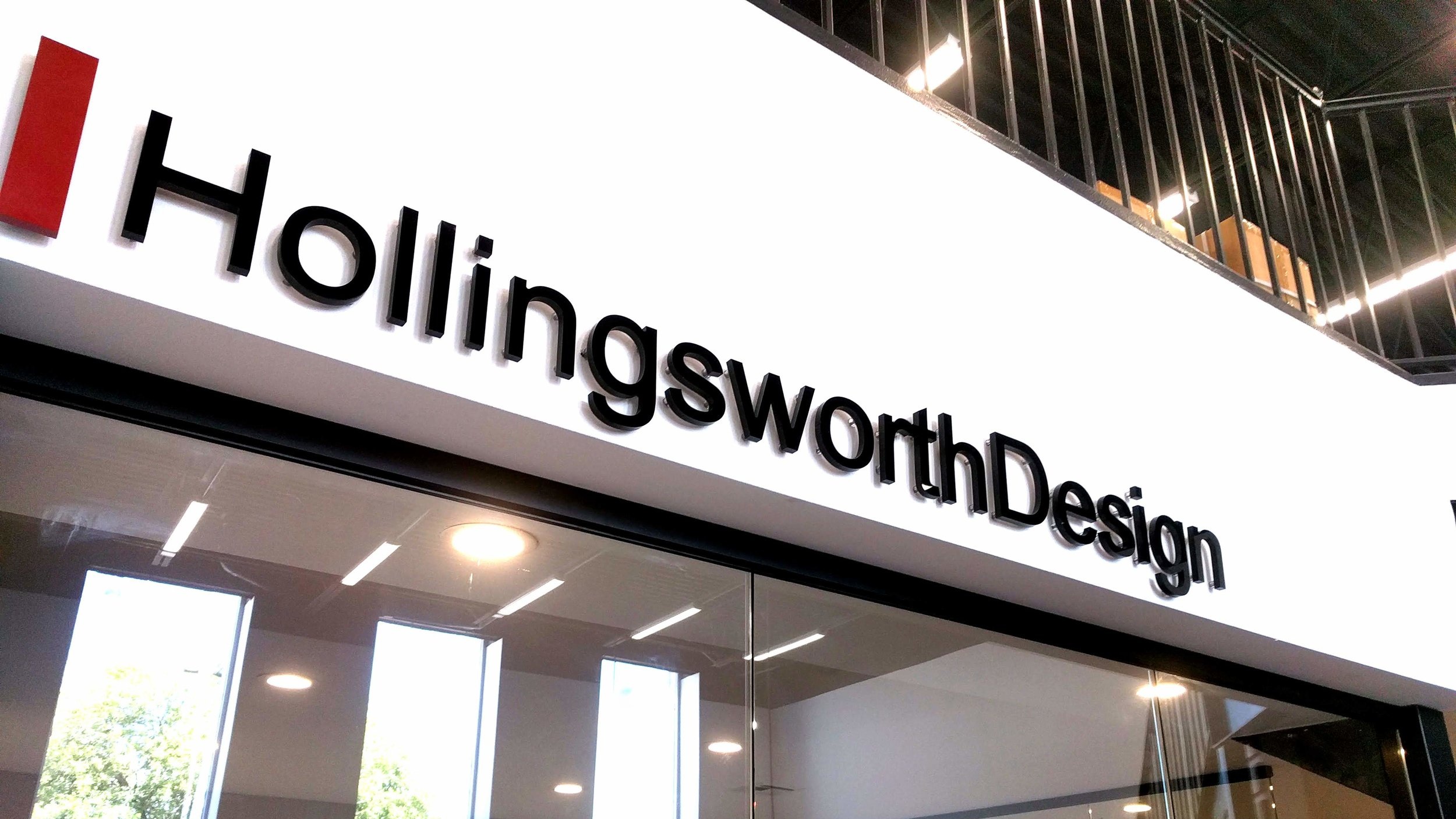 Above door, floating acrylic lettering- Hollingsworth Design