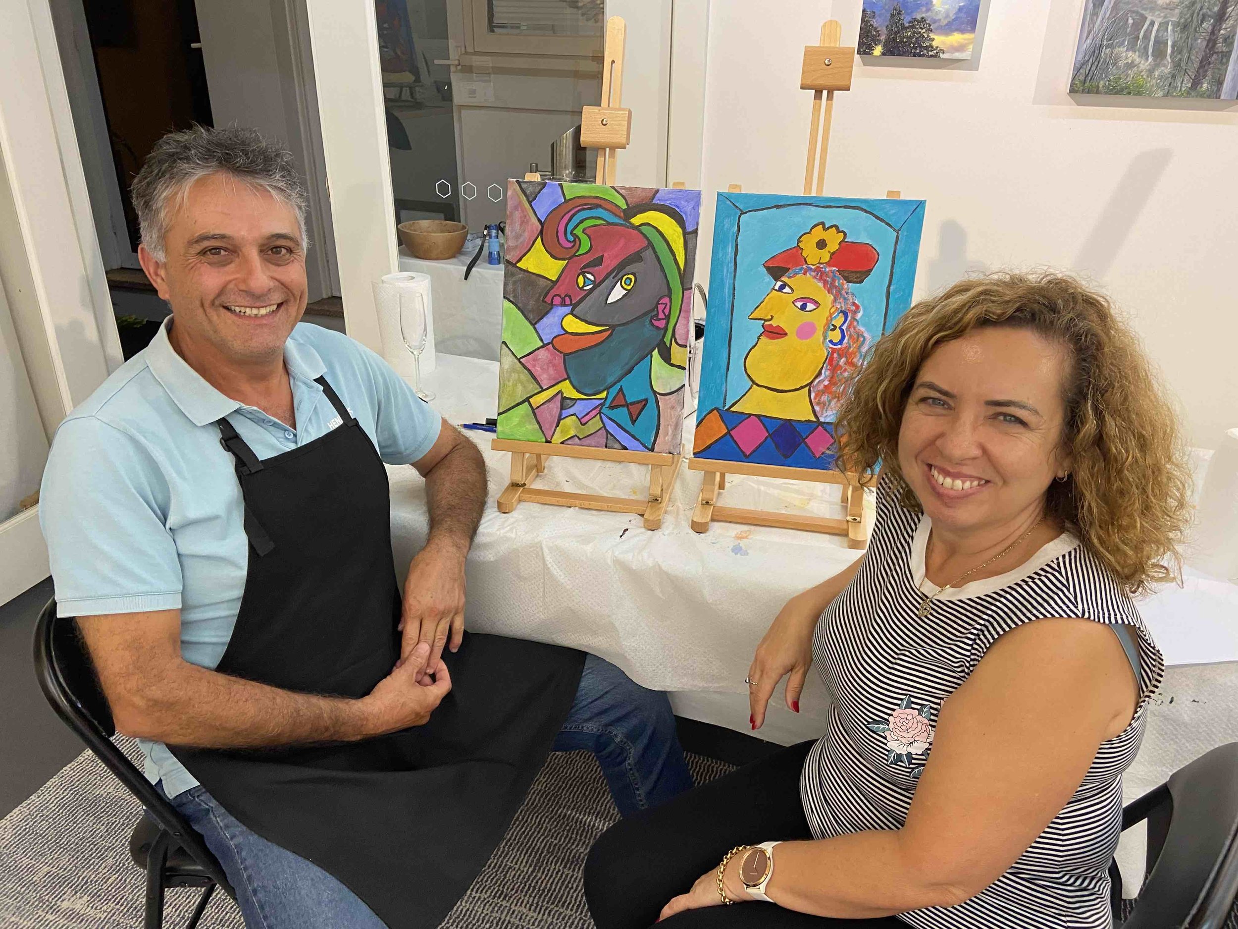 Julio and Maria at Cubist self portrait paint and sip class.jpg