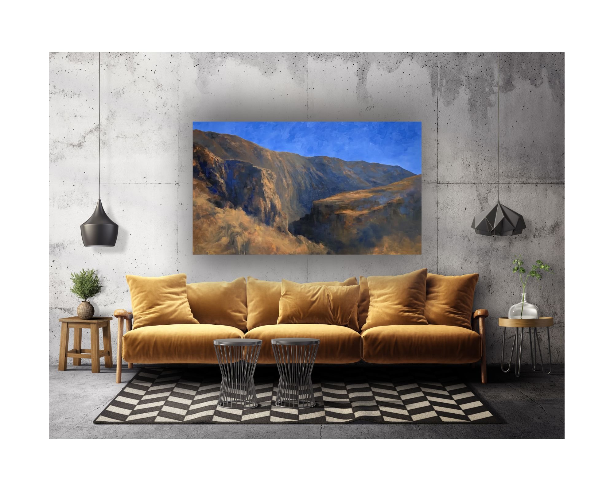 Large desert painting in red oxide and cobalt blue sky over a ochre sofa in a stylish contemporary home