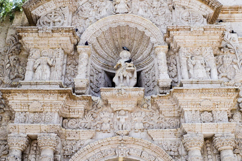 Close up facade of the white sillar rock facade of the Yanhuara San Jose Bautista Church in Arequipa Peru
