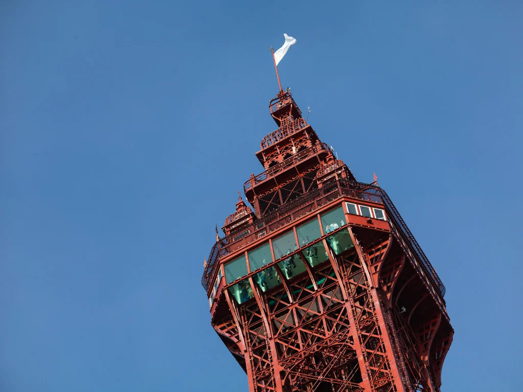 The view of the glass floor of the Blackpool Tower from the ground on a clear day.