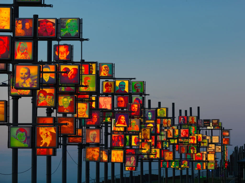 The Blackpool Illuminations of multicolored faces on poles
