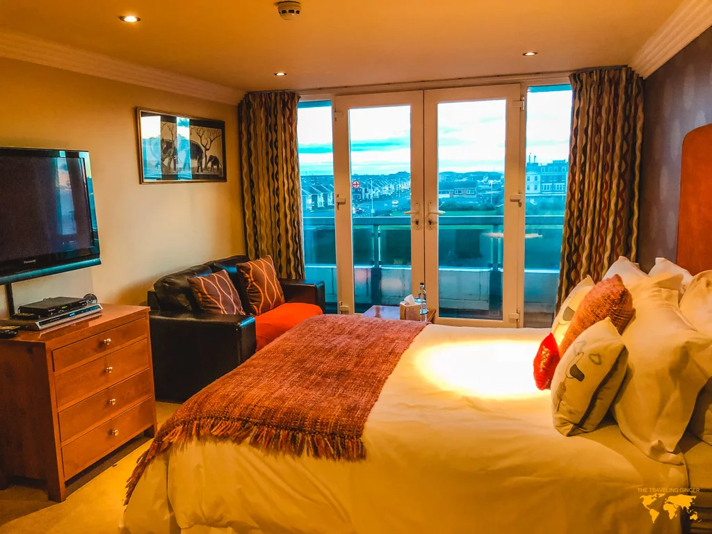 The elephant room with bed and coach at the Number One South Beach Hotel in Blackpool