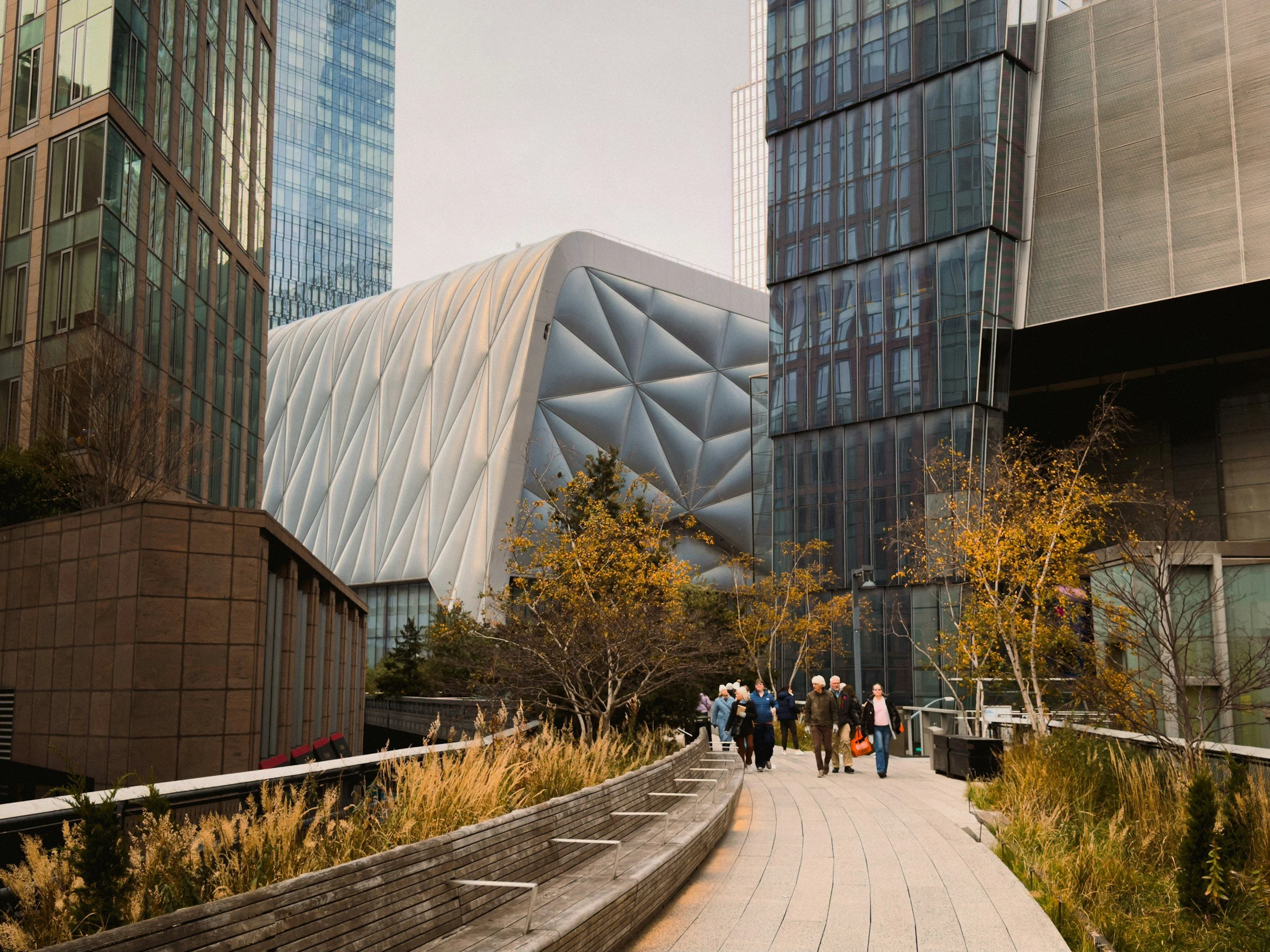 a view of the edge building in nyc from the view of the high line in fall..