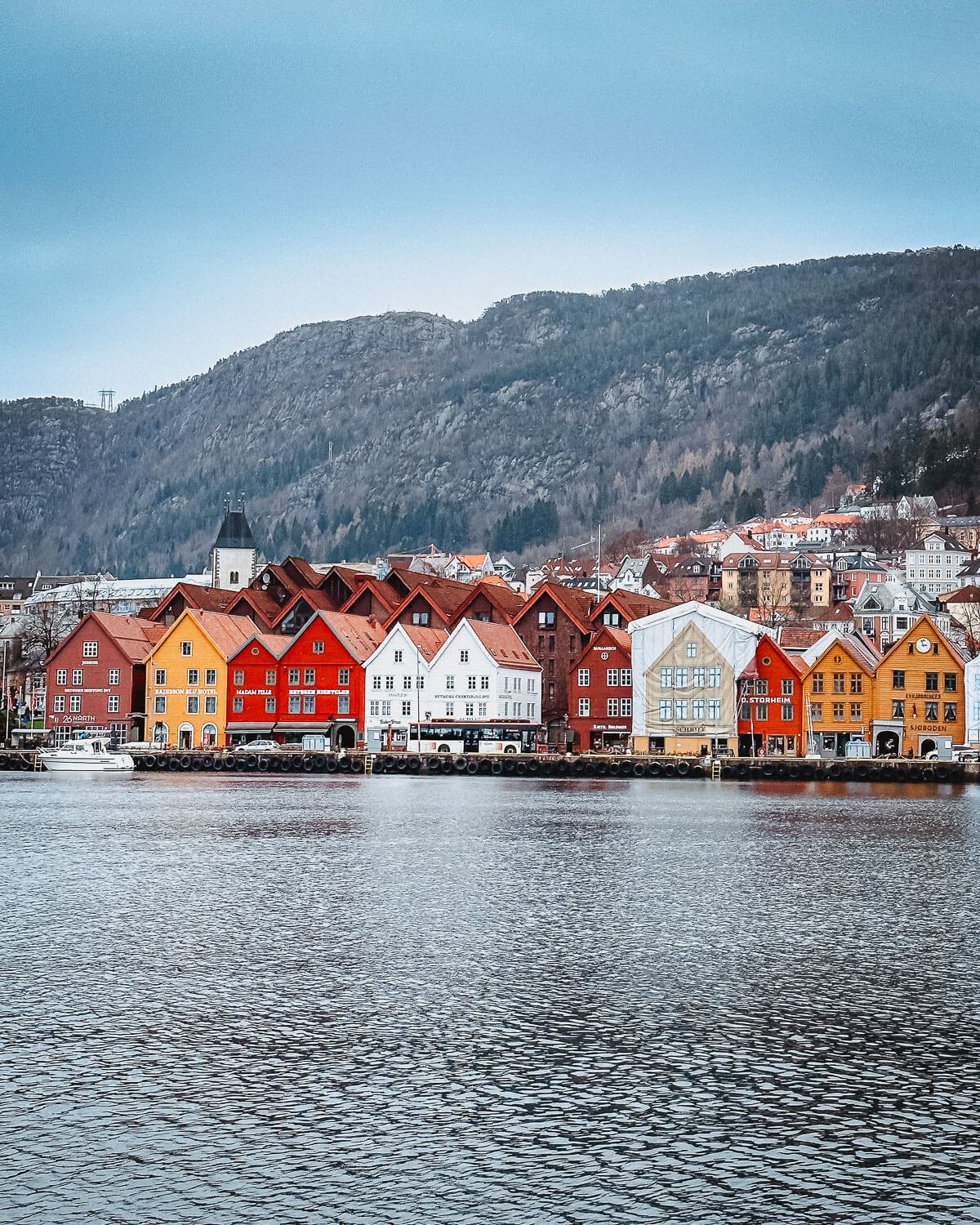 Colorful wooden buildings of Bryggen wharf from the harbor Bergen Norway