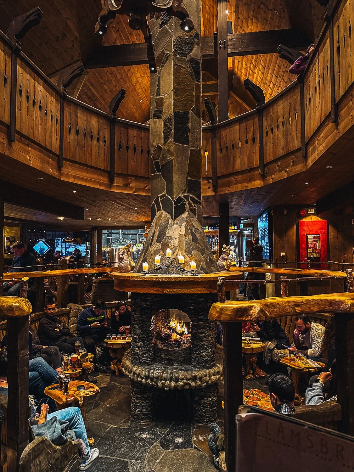 Viking style interior with stone fireplace at Aegir BrewPub Flamsbrygga Flam Norway