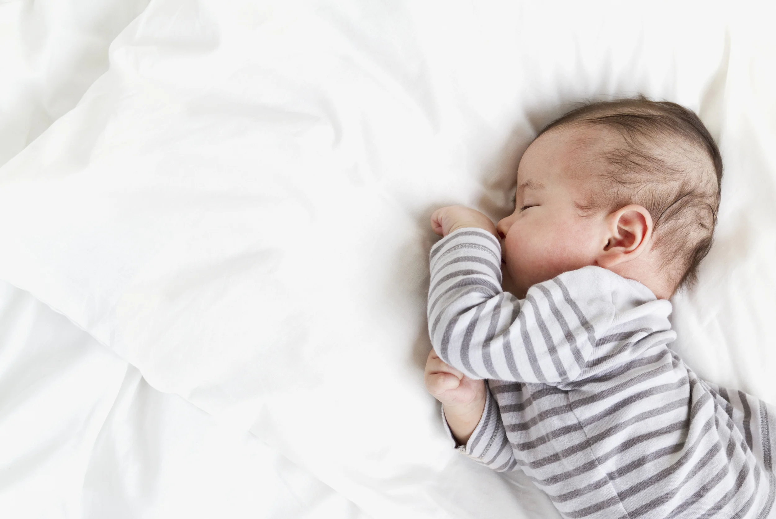 baby-sleeping-on-bed-1.jpg