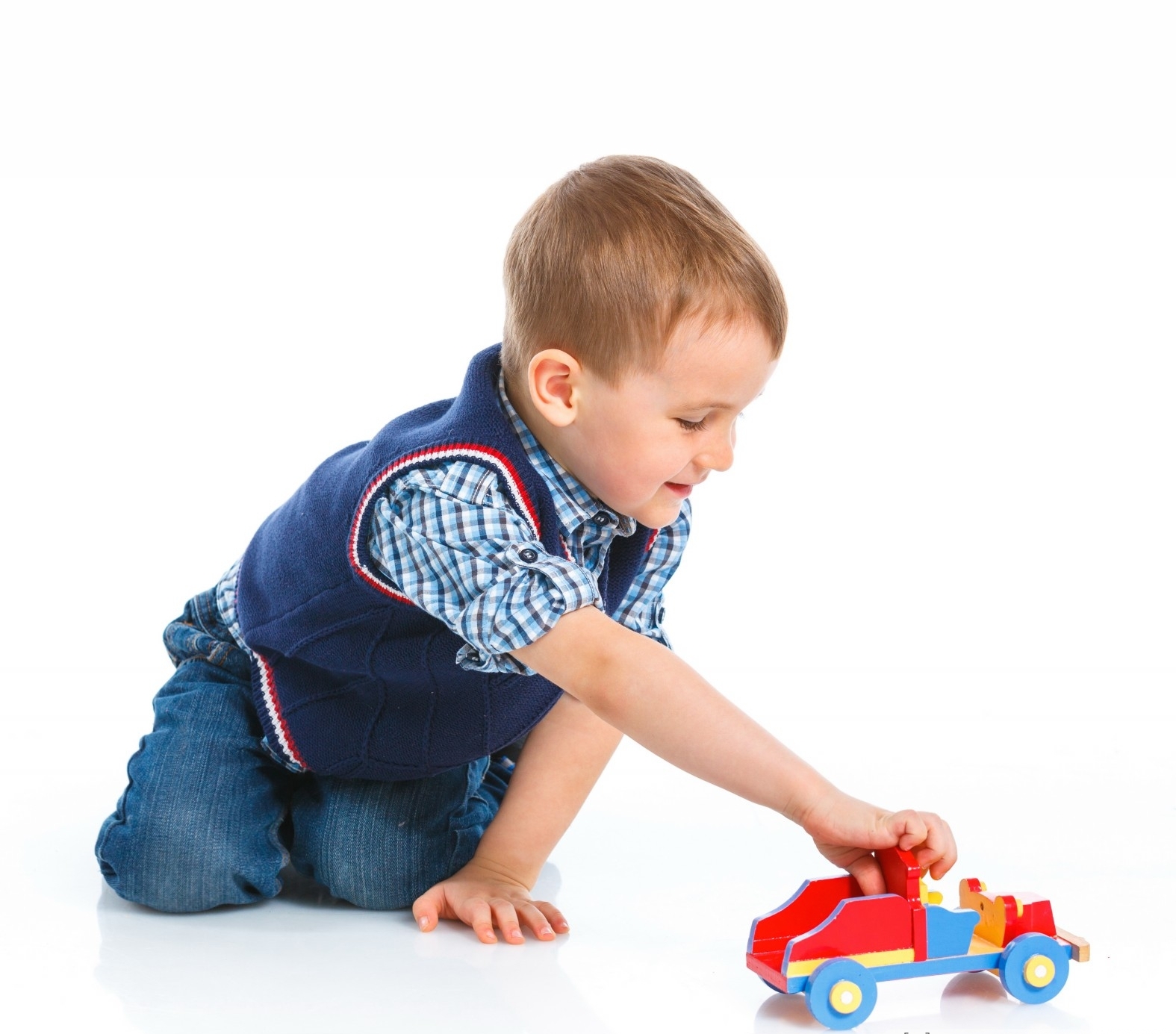 Cute-boy-plaing-with-toy-car-on-floor.jpg