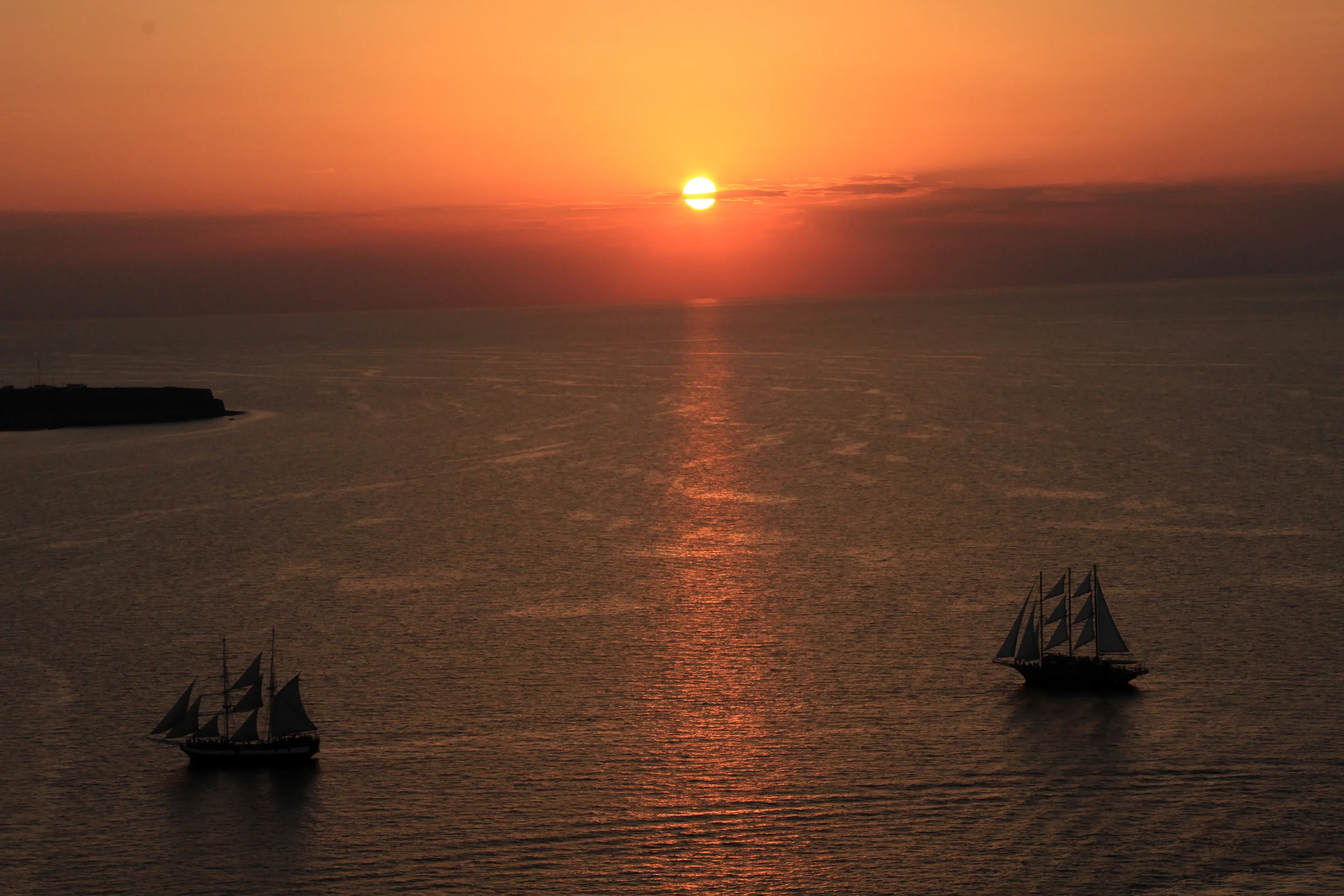 sunset in oia, santorini greece