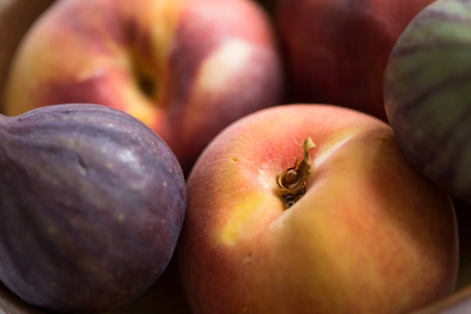 Peaches & figs illustrating Jodie Abrahams' Hormonal Health + Cycle Support services