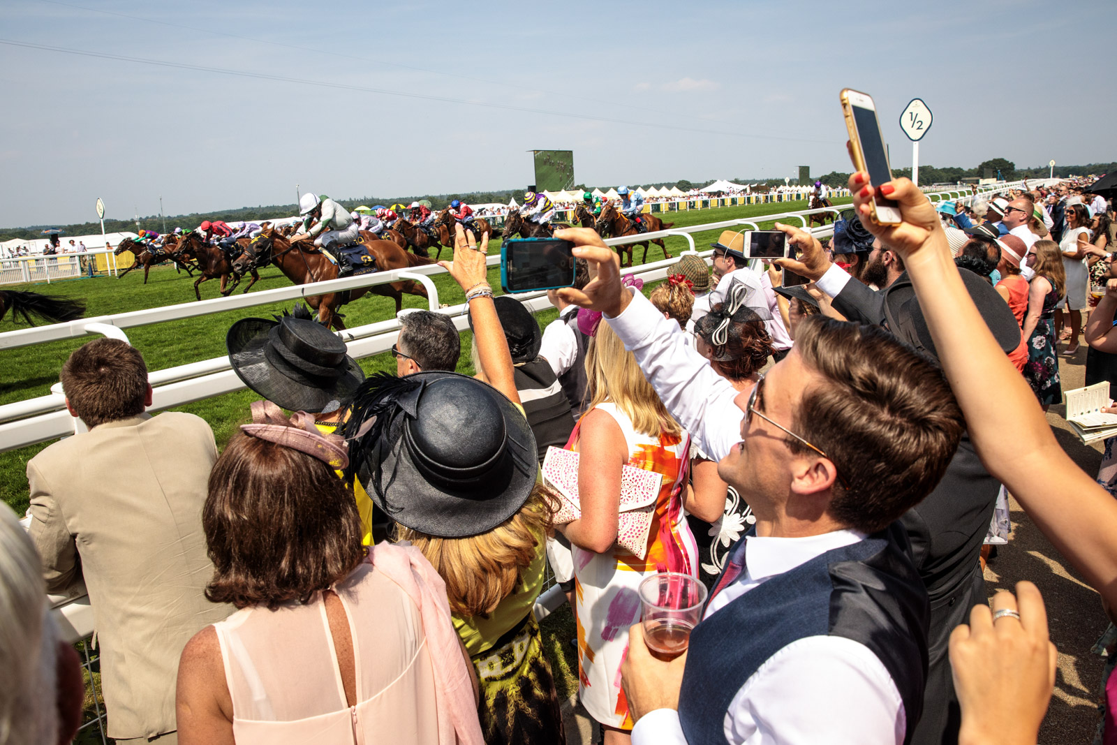 Racegoers take pictures during a race at Royal Ascot 2017 at Ascot Racecourse on June 21, 2017 in Ascot.