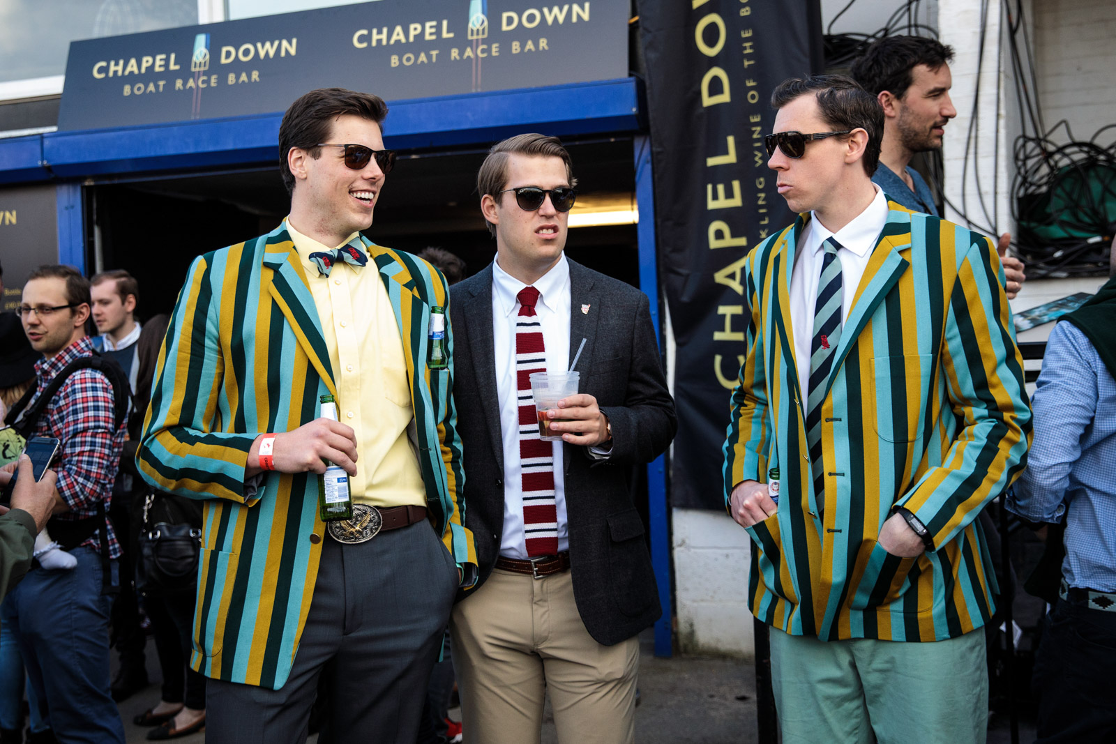  Spectators wearing boating blazers gather during the annual Boat Race between Oxford and Cambridge University along the River Thames in Putney on April 02, 2017 in London. 