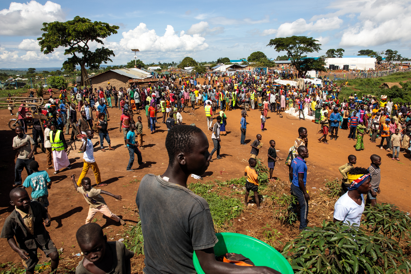  KYANGWALI, UGANDA: Refugees from the Democratic Republic of Congo gather by a market in the Kyangwali Refugee Settlement on April 5, 2018. 