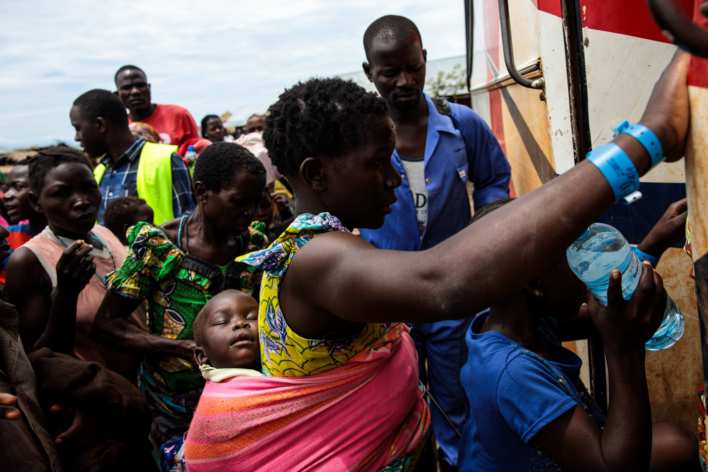 SEBAGORO, UGANDA: Refugees from the Democratic Republic of Congo make their way on to a bus for the Kagoma reception centre from the UNHCR landing site for refugee arrivals on April 4, 2018.