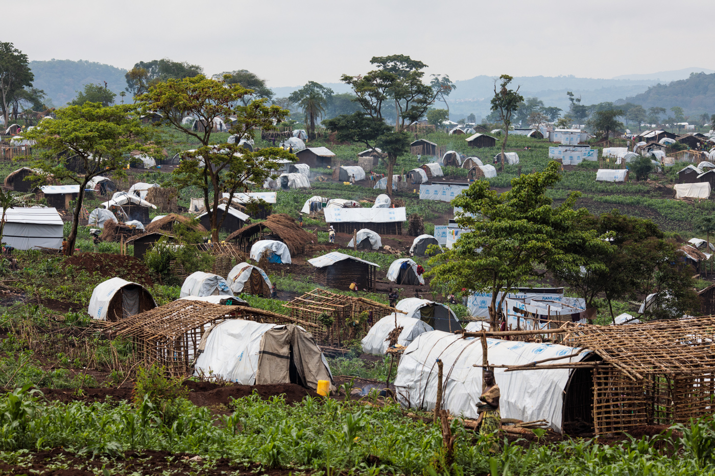  KYANGWALI, UGANDA: Shelters for refugees from the Democratic Republic of Congo stand on a hill in the Kyangwali Refugee Settlement on April 7, 2018. 