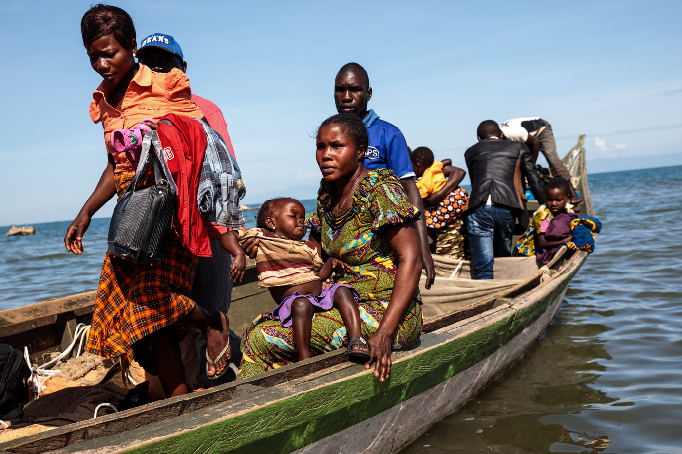  NSONGA, UGANDA: Refugees from Tchomia in the Democratic Republic of Congo arrive on boat at the Nsonga landing site on April 10, 2018. 