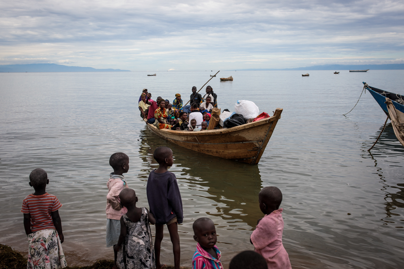 NSONGA, UGANDA: Refugees from Tchomia in the Democratic Republic of Congo arrive on boat at the Nsonga landing site on April 9, 2018.