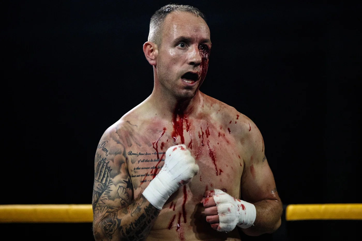 MANCHESTER, ENGLAND: Paul Stredder, 35 from the Wirral looks on bloodied as he fights Brandon Harden, 21 from Edlington during an Ultimate Bare Knuckle Boxing (UBKB) event at Bowlers Exhibition Centre on August 4, 2018.