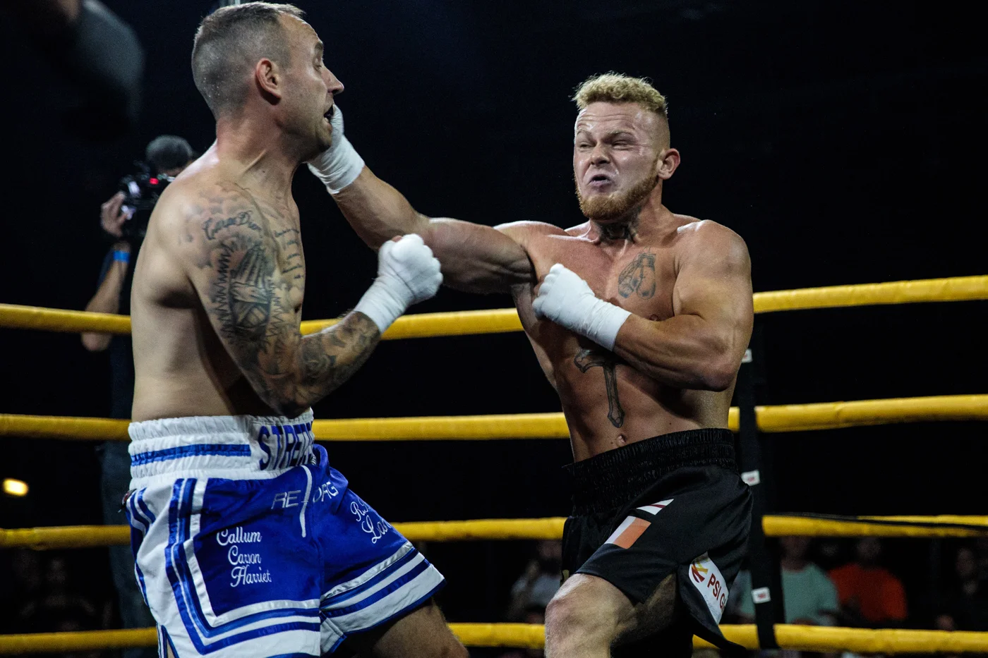 MANCHESTER, ENGLAND - AUGUST 04: Paul Stredder, 35 from the Wirral (L) fights Brandon Harden, 21 from Edlington (R).