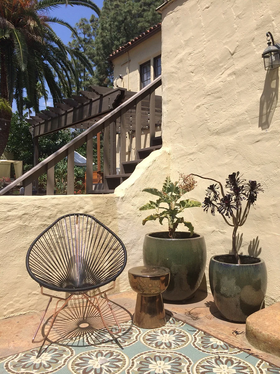 New potted plants and furnishings for a Spanish-style house.