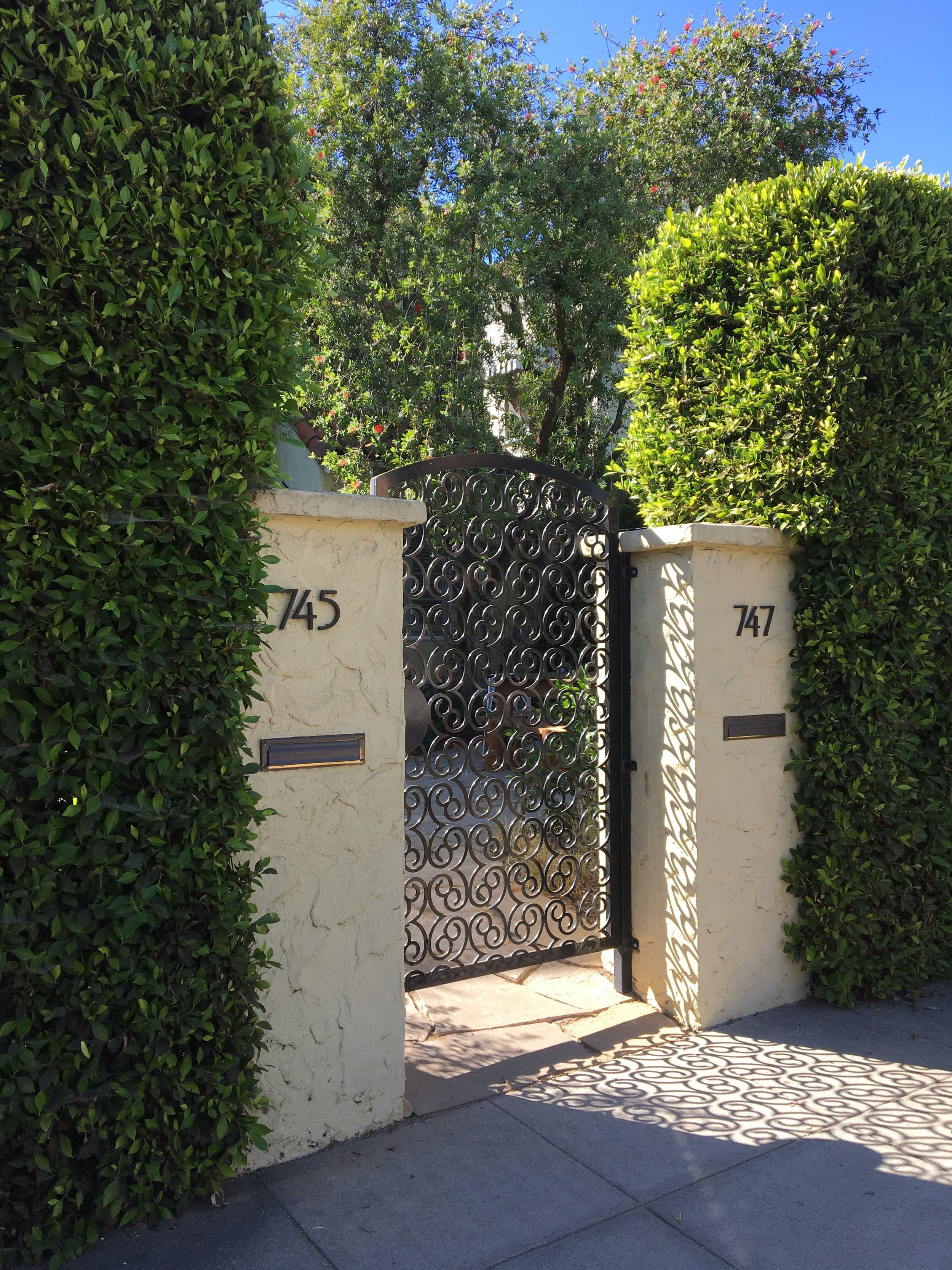 A custom design for a gate with a modern take on the pattern of the existing railings around the house 