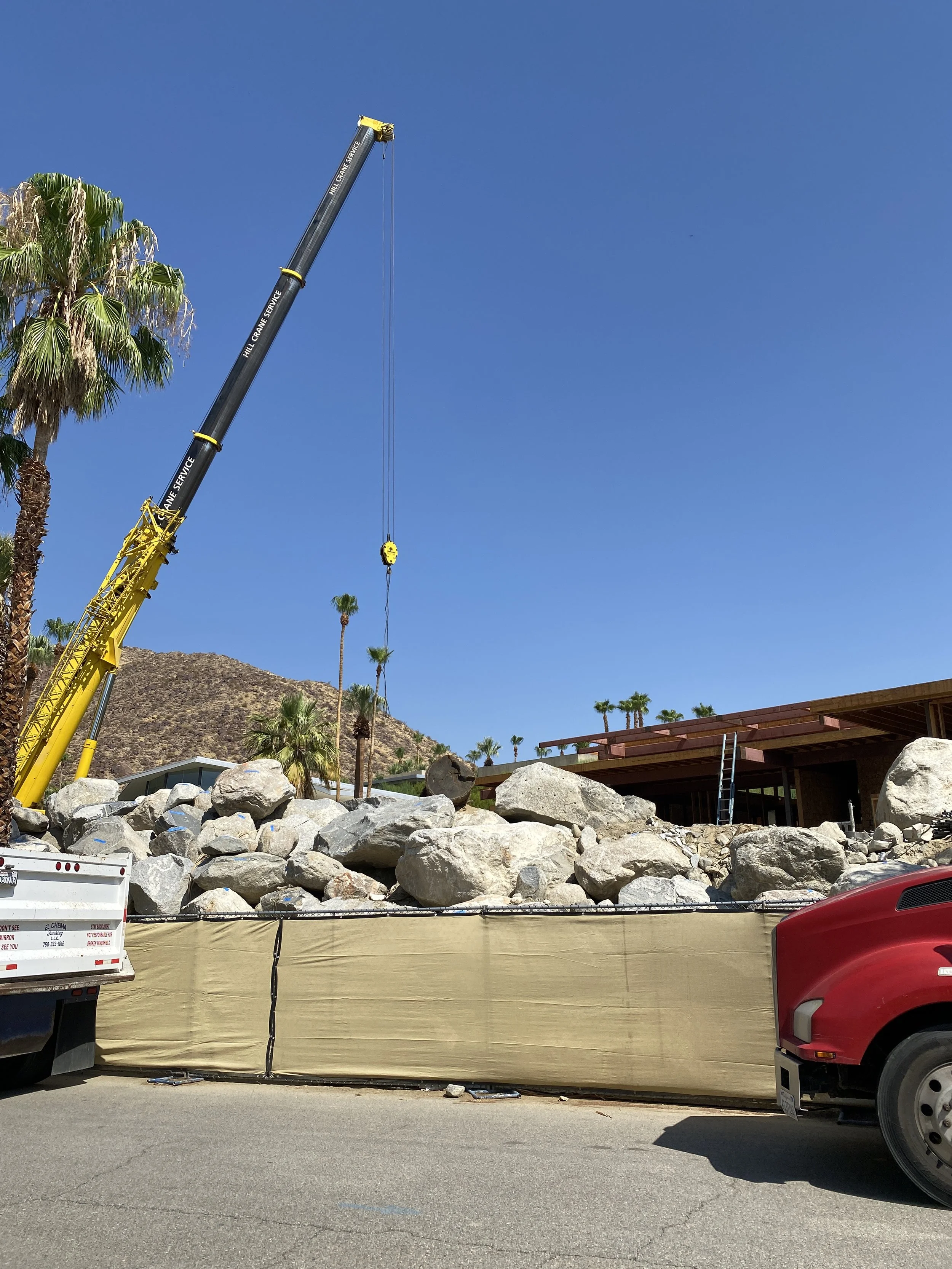 beginning of construction work for a palm springs modern house - removing a mountain of boulders... 