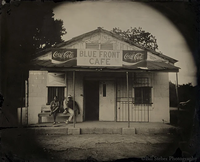 Jimmy "Duck" Holmes in front of his Blue Front Cafe, started by his own parents in the 1940's in Bentonia, MS, making the Blue Front the oldest continuously-operated juke joint in Mississippi.