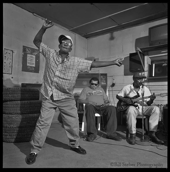 Guitarist Jimmy Holmes and harmonica player Bud Spires play at Blue Front Cafe in Bentonia, MS, owned by Jimmy "Duck" Holmes. The Blue Front Cafe is the oldest continuously-operating Juke Joint in the state of Mississippi.