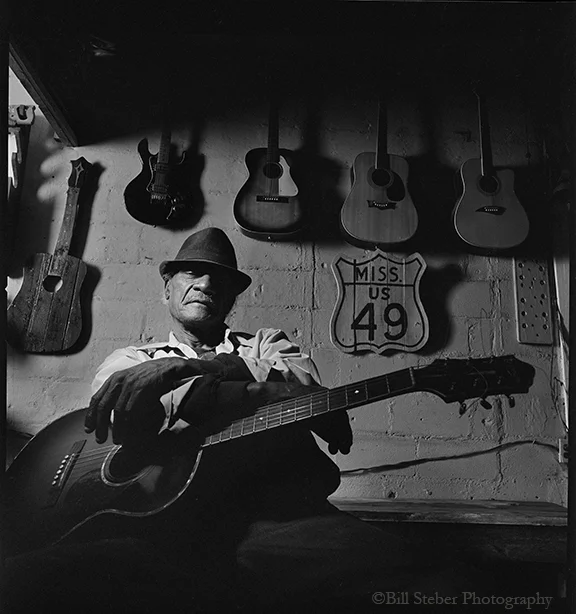 Guitarist Jimmy Holmes plays at Blue Front Cafe in Bentonia, MS, owned by Jimmy "Duck" Holmes. The Blue Front Cafe is the oldest continuously-operating Juke Joint in the state of Mississippi. photo by Bill Steber