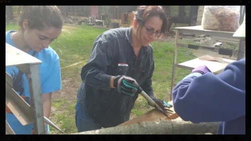 Sealing up the logs and the mushroom spawn within them